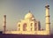 Vintage retro toned sunrise over Taj Mahal.