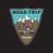 Vintage road trip adventure badge sticker illustration design. Camp outdoor logo with mountain, camper. Retro travel