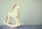 Vintage rocking horse on wooden floor. retro filtered image