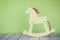 Vintage rocking horse on wooden floor. retro filtered image