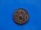 Vintage Roman coin over blue