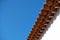 Vintage roof tiles, blue sky, copy space