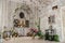 A vintage room with a iron arch with fake window