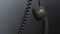 Vintage rotary phone receiver hanging