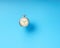 Vintage round mechanical pocket watch on blue background