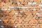 Vintage ruined brick wall with cracks, background and texture, natural design, patterns, extured background with space