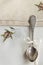 Vintage russian silverspoon with silk ribbon on linen napkin. Old fashion heroloom