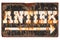 Vintage rusted sign with the Dutch word `Antique` isolated on wh