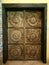 Vintage rustic looking wooden door with artistic details