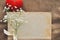 Vintage rustic love card for Valentine`s day-white flowers, yellowed old books and red plush heart on burlap. closeup
