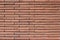 Vintage rustic red color brick wall with a 1/3 offset brickwork pattern