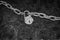 Vintage rusty chain with padlock in black and white.