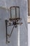 Vintage rusty street lamp on white wall