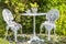 Vintage rusty wrought iron furniture in a garden