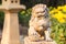 Vintage sandstone lion statue stand in the garden