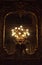 Vintage sconce on black mirror background