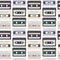 Vintage seamless pattern with analogue music cassettes. 80s Loopable background with magnetic audio tapes