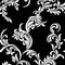 Vintage seamless pattern. White luxurious Vegetative tracery of stems and leaves on a black background.
