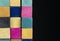 Vintage Set of Cuisenaire Rods Stacked in a random order against a black background