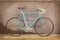 Vintage seventies light blue racing bicycle on a wooden floor