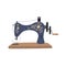 Vintage sewing machine with blue spool thread. Equipment for sew vogue clothes. Handmade