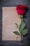 Vintage sheet of paper red scented rosebud on wood