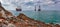 Vintage ships at sea. Landscape of rocks and sea with beautiful cloudy sky and vintage ships