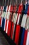 Vintage signal levers all lined up in a preserved heritage railway signal box.  Levers are colour coded and numbered