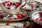 Vintage silverware - dishes and gravy boats, ice, and red berries