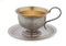 Vintage silverware, very old rich decorated metal cup for coffee on a saucer isolated on a white background, close up