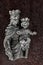 Vintage small idol of Mary and child jesus on wooden plank