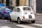 Vintage small white Fiat 500 car back view