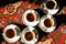 Vintage soviet porcelain cups of tea with saucers on turkish carpet, traditional tea ceremony, sunlight