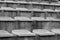 Vintage sports background seats in a small provincial stadium. Background of empty seats on the steps of the stands for football