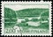 Vintage stamp printed in Finland 1963 shows farm on lake shore