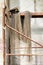 Vintage still life with a net and nautical hat on the rusty scaffolding