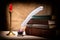 Vintage still life with old books near inkstand, feather and candle in candlestick on canvas background. Literature concept.