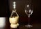 Vintage straw bottle of wine and glass wine