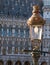Vintage street lamp with the Gothic Brussels Town Hall in the background