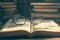 Vintage study vibes Close up of open book with eyeglasses