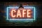 Vintage style cafe neon sign on textured brick wall backdrop