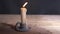 Vintage style candle flickers in candle holder