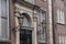 Vintage style lanterns on facade of old dutch building