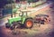 Vintage style picture of old tractor used in timber industry.