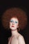 Vintage style portrait of beautiful woman with fancy makeup and afro hair