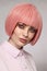 Vintage style portrait of beautiful woman in fancy pink wig