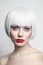 Vintage style portrait of beautiful woman with platinum blonde hair and red lips