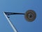 Vintage style street lamp detail under blue sky and white clouds in low angle perspective