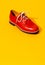 Vintage stylish shoes in isometric on yellow background. Minimal fashion concept