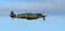 :Vintage Supermarine Spitfire MK Vc G-AW11 AR501 in flight close up.